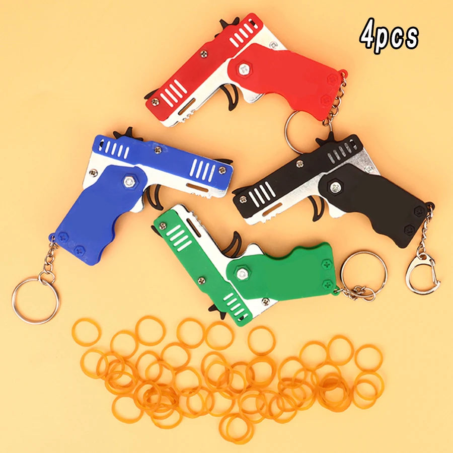 Mini Lanzador de Ligas con Llavero – Juguete Portátil con 60 Ligas, Regalo Divertido para Niños y Adultos